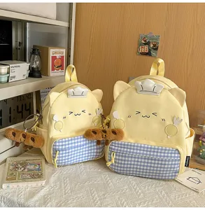 Cute yellow cat backpack with plaid pocket and chef hat design, sweet school bag for girls.