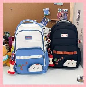 Mochila escolar grande para estudiantes con colgante de manzana, bolso casual de lona diario.