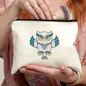 Close-up view showing the zipper detail and cute owl print on the white canvas cosmetic travel bag.