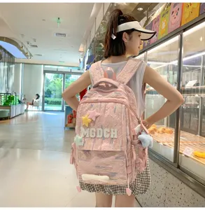 Cute pink casual backpack detail view with star charms and embroidered letters for daily school.