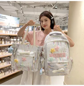 Casual Japanese style canvas backpack and tote bag set with cute star pendants for daily use.