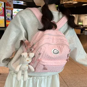 Sweet pink canvas backpack for women and girls, cute casual school bag with bunny pendant.