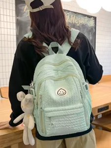 Sweet mint green girl backpack with cute rabbit pendant, soft textured casual school bag.