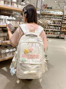 Japanese ins style casual backpack with colorful graffiti and plush star decoration for daily use.