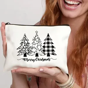 Neceser de maquillaje de lona blanca con bonito estampado navideño y cierre de cremallera.