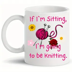 Close-up detail of the white ceramic coffee mug featuring custom knitting print design.