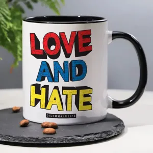 Close-up of ceramic coffee mug with black handle and bold typography design for office.