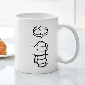 White ceramic coffee mug with unique custom fist line art print for office daily use.