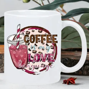Close-up detail of a white ceramic coffee mug featuring a stylish slogan and graphic print.