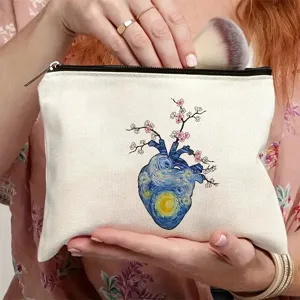 Bolsa cosmética de lona con cremallera y estampado de corazón anatómico estrellado.