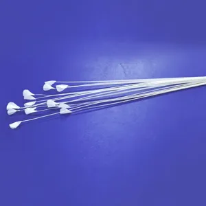 Detail shot of white artificial flower stamens accessory for floral arrangement decor.