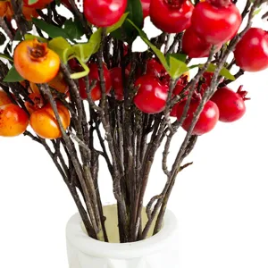 Artificial pomegranate fruit branches in white vase for home desktop pastoral decor
