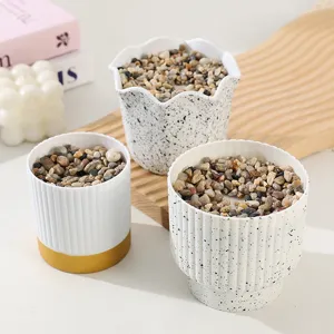 Nordic minimalist flower pot detail view, creative imitation stone planter for succulent plants.