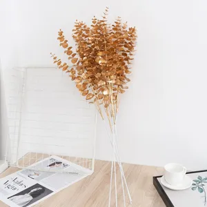 Gold artificial eucalyptus leaves branches for home decor, wedding and floral arrangements.