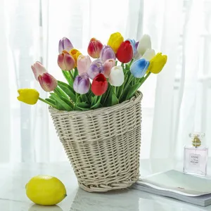 Artificial tulip flowers bouquet in wicker basket for home decor and photography props