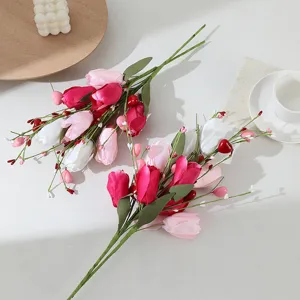 Detailed view of colorful artificial tulip bouquets with realistic green stems and cute decor.