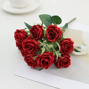 Artificial red silk rose bouquet detail, vibrant flower arrangement for home decor and weddings.