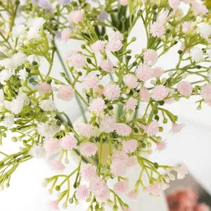 Artificial gypsophila plastic fake flowers green stems pink white floral decor detail view