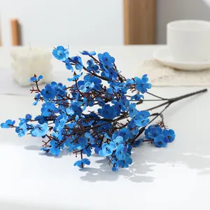 Close-up detail of artificial blue gypsophila branch, perfect for elegant home decor and floral arrangements.