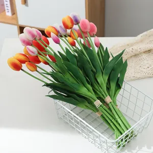 Artificial PU tulip flower bouquet placed in a white wire basket, perfect home decor.