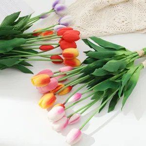 Detailed shot of artificial PU tulips bouquet, soft touch faux flowers for home decor.