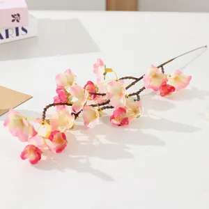 Artificial cherry blossom branch detail shot, pink floral home decor and wedding props.