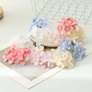 Artificial hydrangea flower heads detail view for DIY crafts, apparel, and gift box decor.