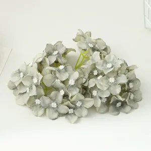 Artificial small hydrangea flower head detail close up view for DIY crafts and gift box decoration.