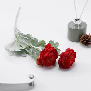 Three-headed flocked ranunculus artificial flower detail showing realistic red petals and leaves.