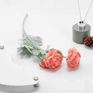 Three-headed flocked ranunculus artificial flower detail shot, perfect for wedding decor.