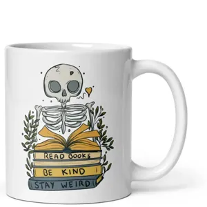 White ceramic coffee mug with cute reading skeleton illustration and inspiring book quotes.