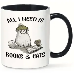 Close up of ceramic mug featuring cute cat illustration and funny book reading quote text.