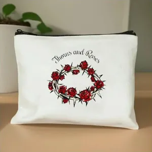 Comoda borsa per cosmetici bianca in tela con cerniera e bellissimo design di rose.