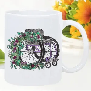 White ceramic coffee mug detail showcasing a unique floral wheelchair art print for office use.