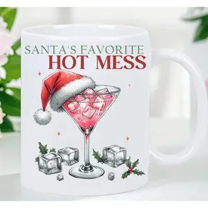 Close-up detail of the printed Christmas cocktail graphic and fun quote on the white ceramic mug.