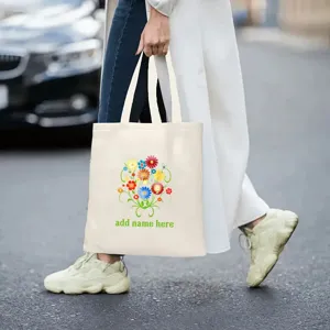 Borsa tote in tela con stampa floreale e testo personalizzato, ideale per tutti i giorni o come regalo.