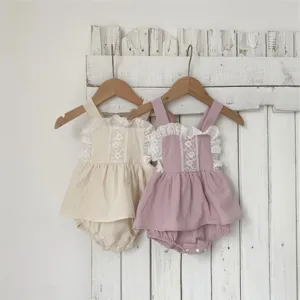 Detailed shot of infant baby cotton lace strap romper, cute ruffle design, soft fabric.