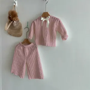 Cute baby girl pink long sleeve top and wide leg pants set with bow detail autumn wear.