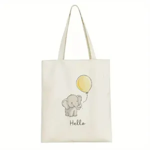 Detail van canvas tote bag met schattige olifant, gele ballon en hello print ontwerp.