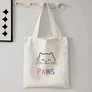 Casual witte canvas shopper tas met een schattig katten gezicht en kleurrijke opdruk.