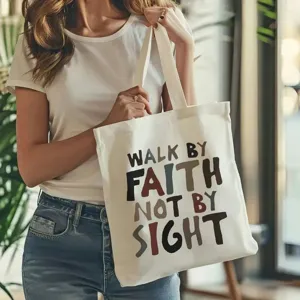 Dettaglio borsa shopper in tela con stampa tipografica ispiratrice, tessuto resistente.