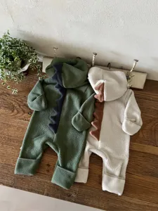 Cute baby dinosaur fleece hooded jumpsuit with spine design, warm anti-wind cuffs for infants.