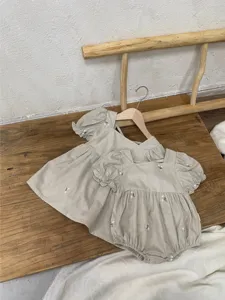 Baby summer cotton embroidered puff sleeve dress and baby romper set detail, cute floral design.