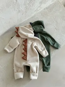 Detail view of baby fleece dinosaur romper featuring cute back spikes and warm hood design.