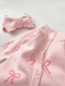 Infant baby girl pink knitted cardigan romper and bow headband set, cute knit bow pattern detail.
