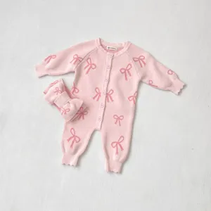 Pink knit baby romper set with long sleeves and cute bow pattern, comfortable infant footed bodysuit.