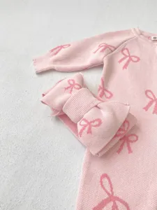 Infant pink knit romper with cute bow pattern and matching headband for baby autumn wear.