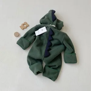 Close-up of baby green fleece dinosaur romper with cozy hood, back spikes, and warm cuffs.