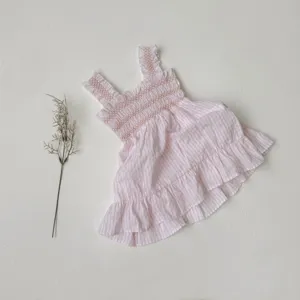 Pink striped baby girl smocked strap dress detail, featuring cute sleeveless ruffle design.