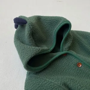 Green infant fleece dinosaur hooded romper detail with soft fabric, cute spikes and wood buttons.
